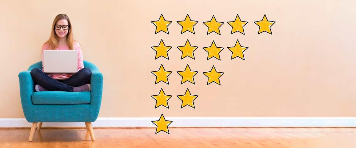 woman sitting on chair with rating level stars graphic to demonstrate the idea of the importance of a sales competency rating system